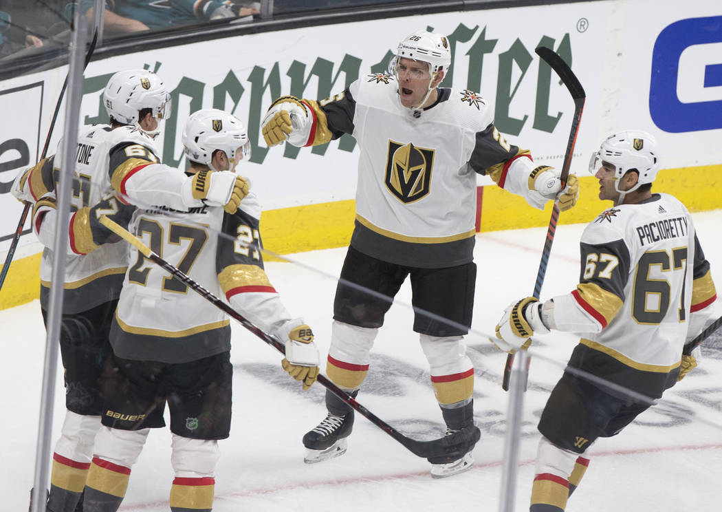 Golden Knights center Paul Stastny (26) celebrates with teammates Max Pacioretty (67) and Shea ...