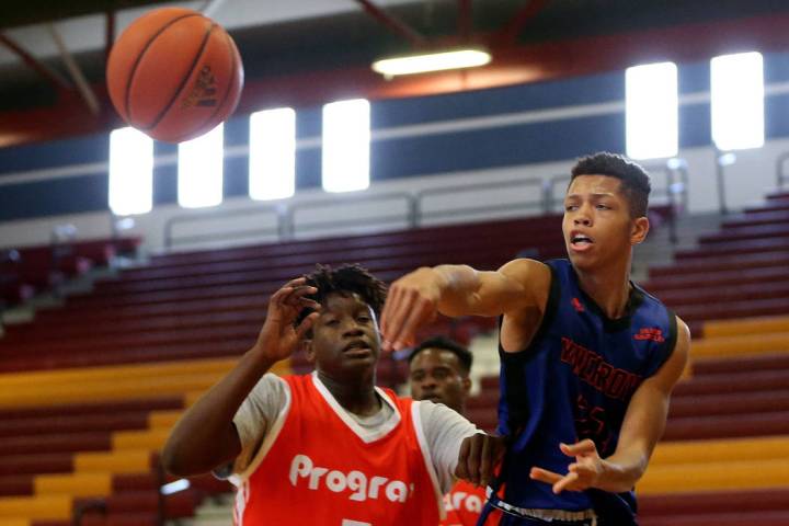 Las Vegas Knicks guard Nick Blake (23) makes a pass during his basketball game at Del Sol Acade ...