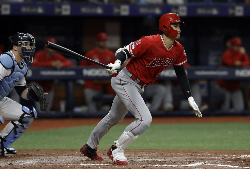 Los Angeles Angels' Shohei Ohtani, of Japan, watches his triple off Tampa Bay Rays' Ryan Yarbro ...