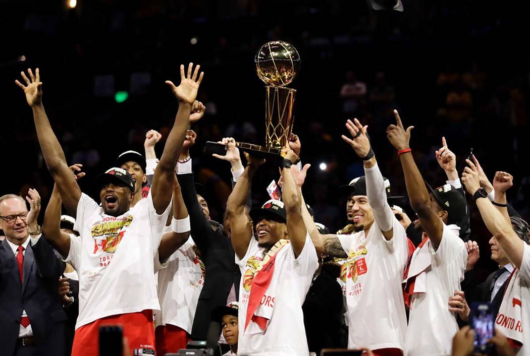 Toronto Raptors center Serge Ibaka, left, guard Kyle Lowry, center, and guard Danny Green, thir ...