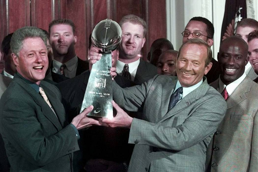 In a June 16, 1998, file photo, then President Clinton, left, and Denver Broncos owner Pat Bowl ...