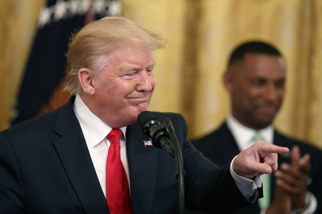 President Donald Trump gestures into the audience as he speaks about second chance hiring in th ...