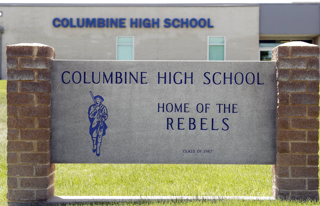 Signs outside Columbine High School are photographed, Thursday, June 13, 2019, in Littleton, Co ...