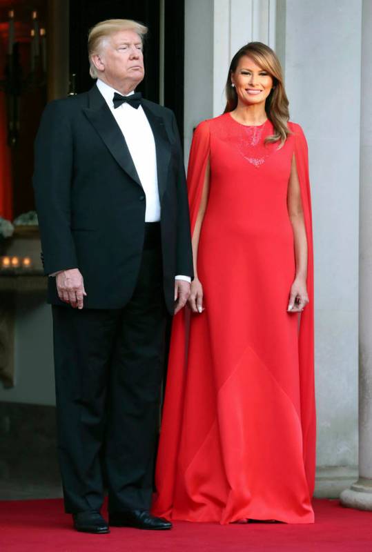 US President Donald Trump and first lady Melania Trump wait to greet Britain's Prince Charles a ...