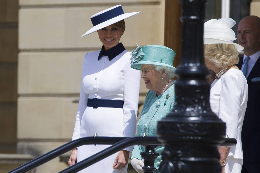 First lady Melania Trump, left, stands with Queen Elizabeth II, and Camilla, Duchess of Cornwal ...