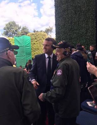 World War II Army veteran Onofrio "No-No" Zicari, 96, poses for a photo with French President E ...