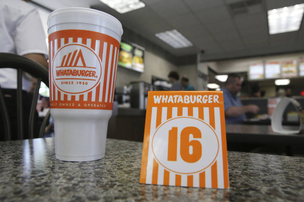 A Whataburger tent order number sits on a table in Dallas, Wednesday, Aug. 9, 2017. (AP Photo/L ...