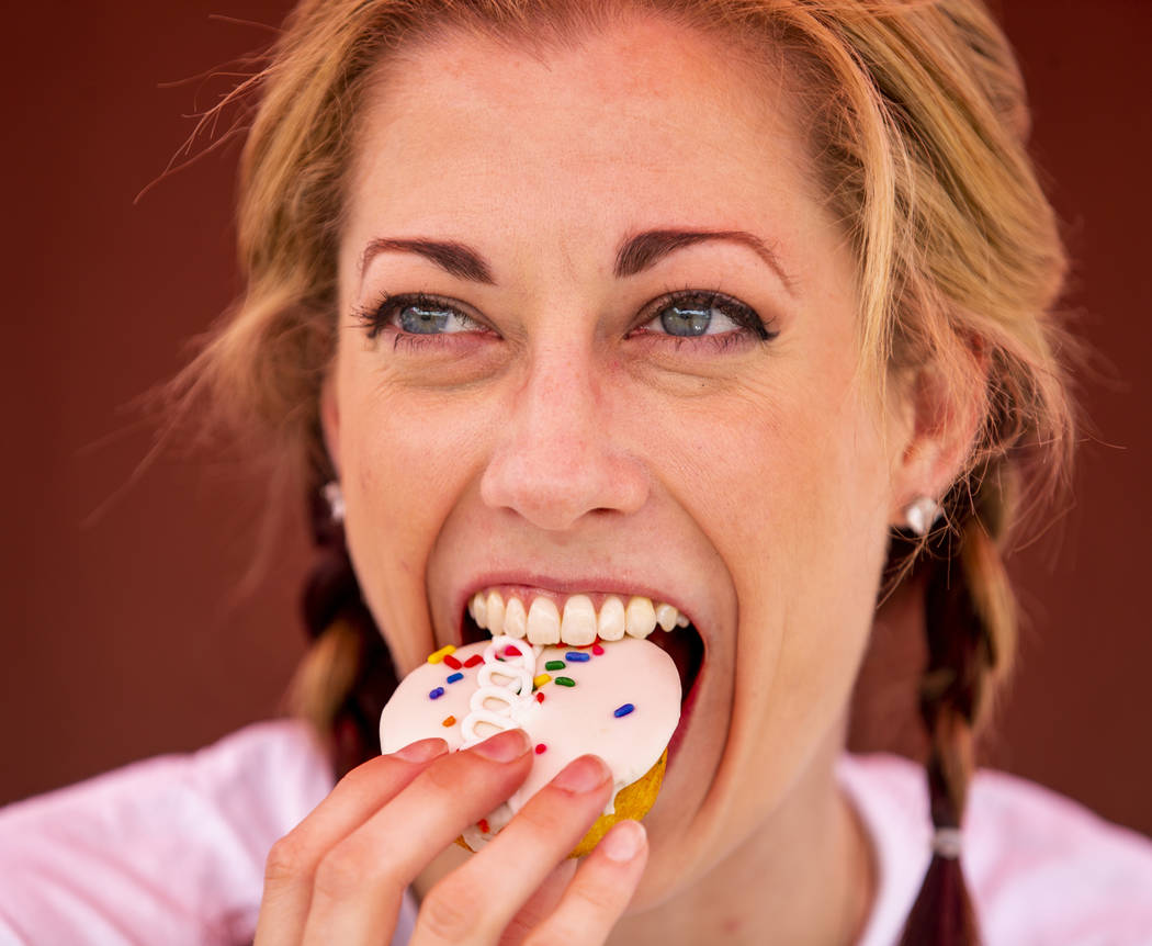 Hostess promoter Casey Weems samples a Hostess Birthday Cupcake while on a stop at the Hoover D ...