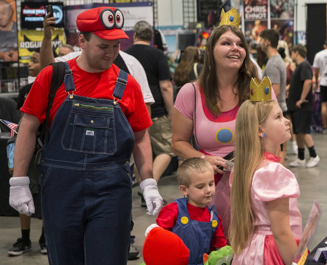 Scott McClain, left, with son Ethan, 4, wife Kylah and daughter Ashlynn, 8, explore the North H ...