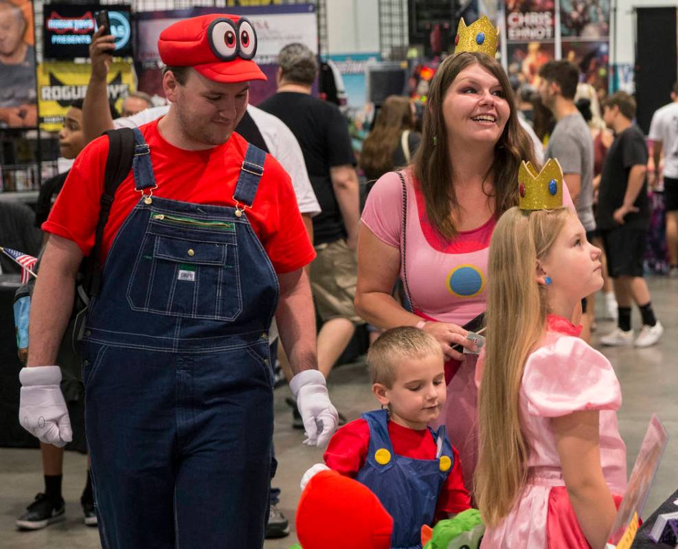 Scott McClain, left, with son Ethan, 4, wife Kylah and daughter Ashlynn, 8, explore the North H ...