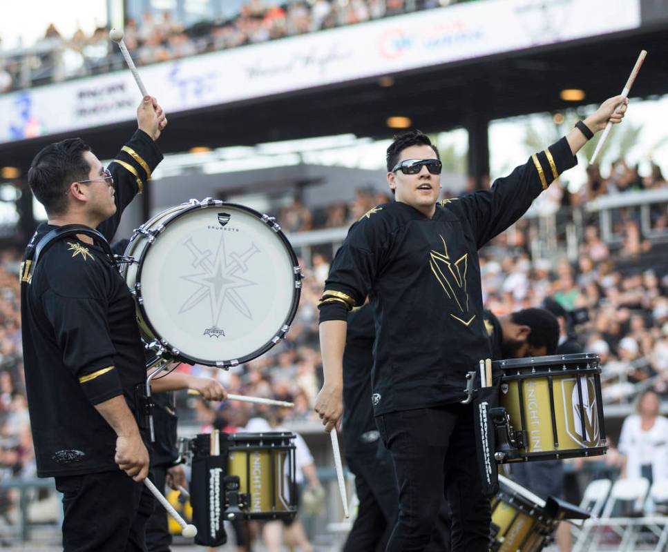 The Golden Knights Knight Line drummers perform before the start of the Battle For Vegas Charit ...