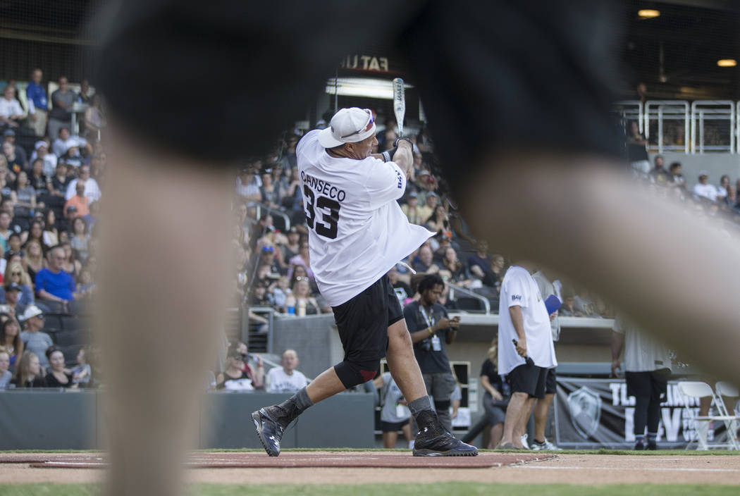 Former Major League Baseball player Jose Canseco takes a swing during the home run derby at the ...