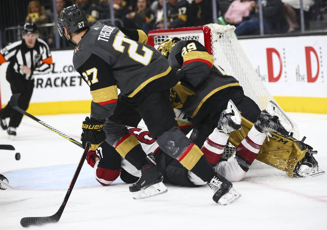 The puck, lower left, flies into the net past Golden Knights goaltender Marc-Andre Fleury, who ...