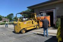 In this Monday, June 10, 2019 photo, workers removed the 12,000 pound open MRI machine from a h ...