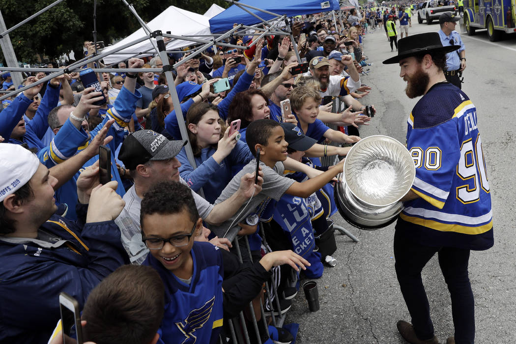 St. Louis Blues center Ryan O'Reilly carries the Stanley Cup during the Blues' NHL hockey Stanl ...