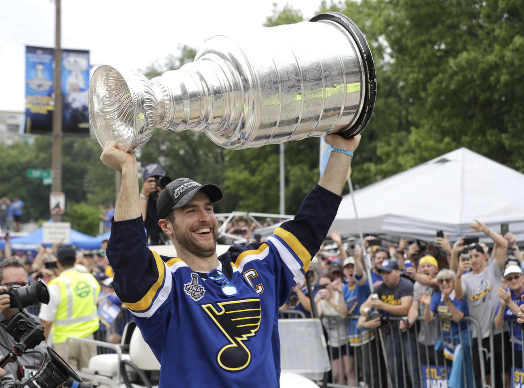 St. Louis Blues defenseman and captain Alex Pietrangelo carries the Stanley Cup during the Blue ...