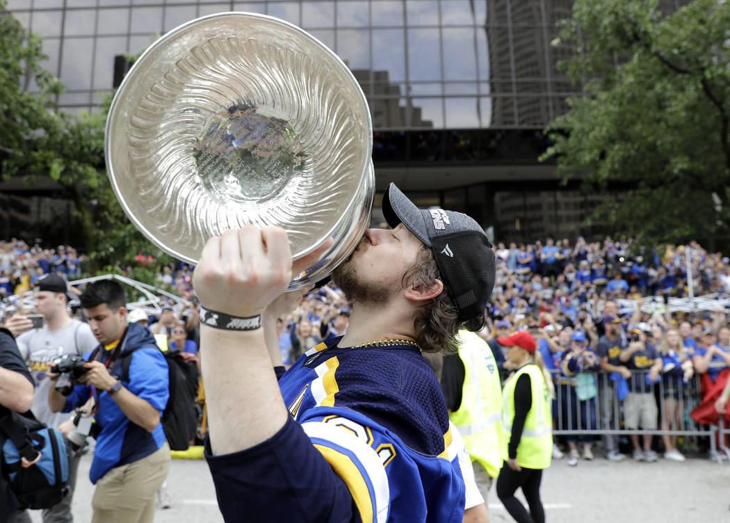 St. Louis Blues right wing Vladimir Tarasenko, of Russia, kisses the Stanley Cup during the Blu ...