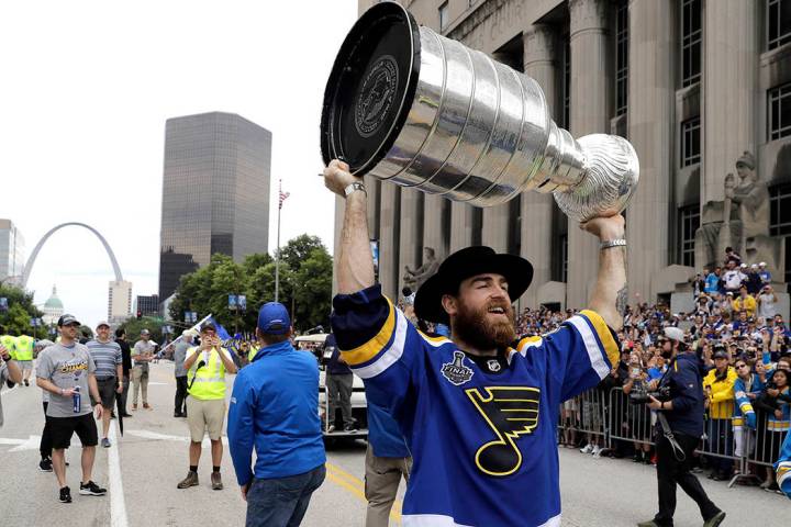 St. Louis Blues center Ryan O'Reilly carries the Stanley Cup during the Blues' NHL hockey Stanl ...