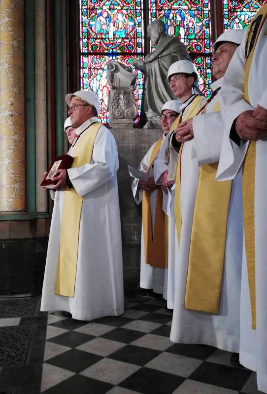 Priests attend a service led by Archbishop of Paris Michel Aupetit during the first mass in a s ...