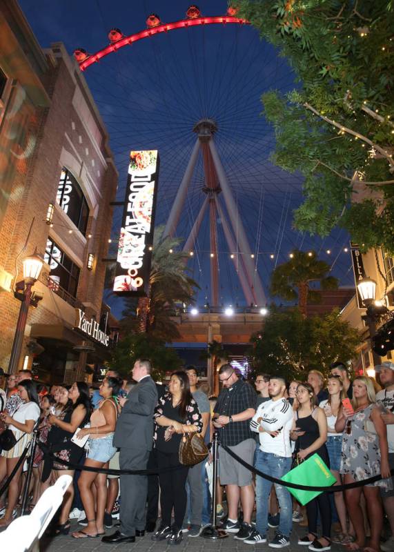 Fans watch as Emmy Award-winning TV host, Jimmy Kimmel, arrives at his comedy club during the G ...