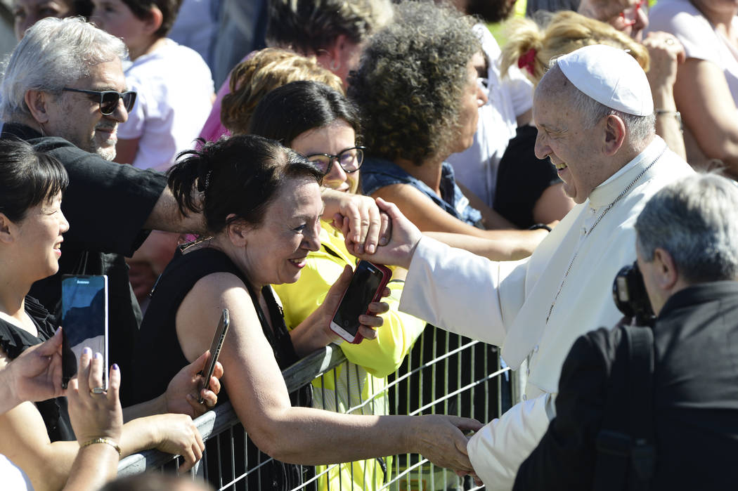 Pope Francis greets residents of temporary houses in the village of Cortine, that was severely ...