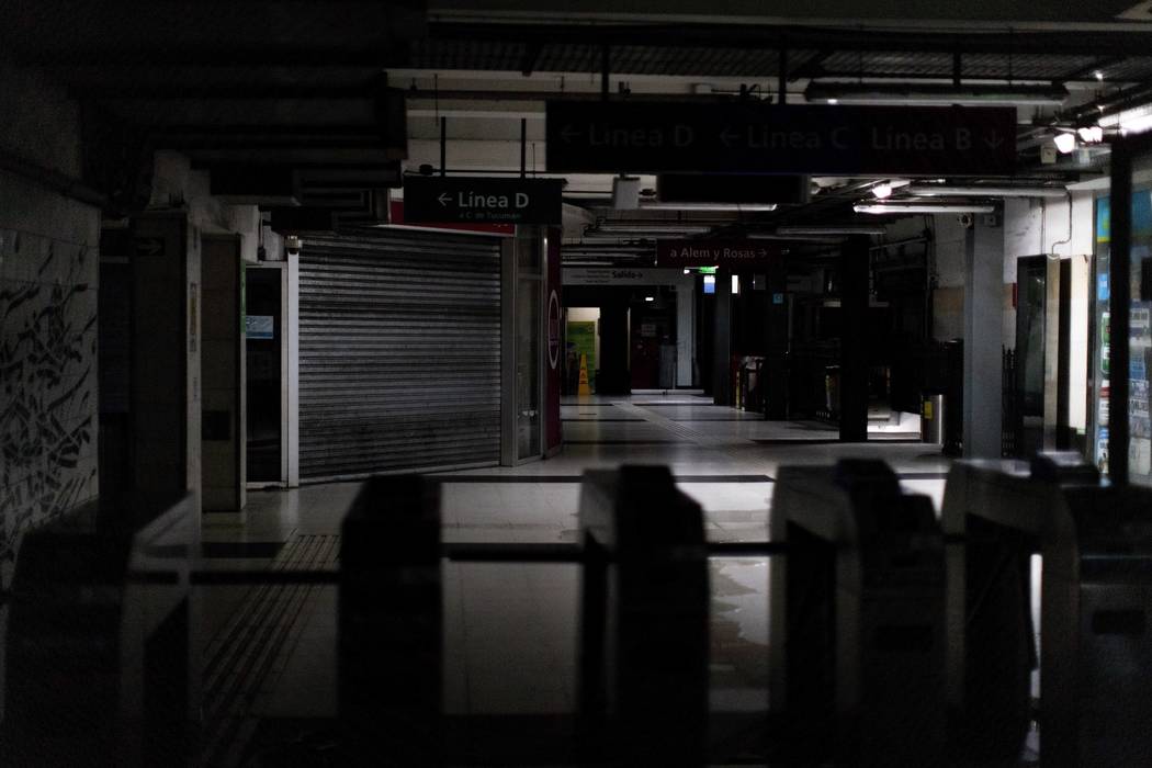 Hallways of Buenos Aires's subway are lit only by emergency lights during a blackout, in Buenos ...