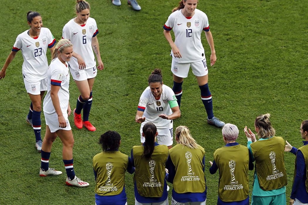 United States' Carli Lloyd, center, celebrates after scoring the opening goal during the Women' ...