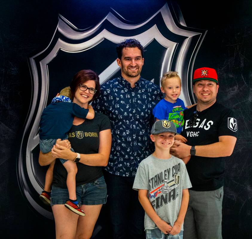 Golden Knights player Mark Stone stands with the Perez family of Las Vegas during a fan photo o ...