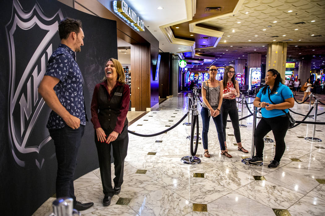 Golden Knights player Mark Stone shares a laugh with MGM Grand employee Maureen Johansson durin ...