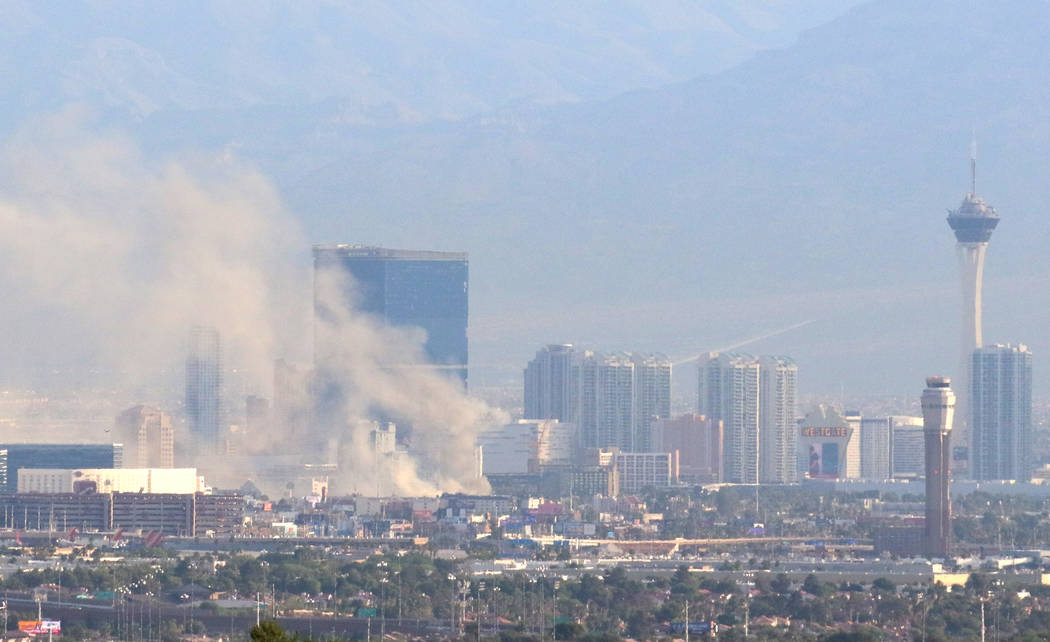 Heavy smoke is seen as fire crews battle a blaze at The Park at 3900 at 3900 Paradise Road, nea ...