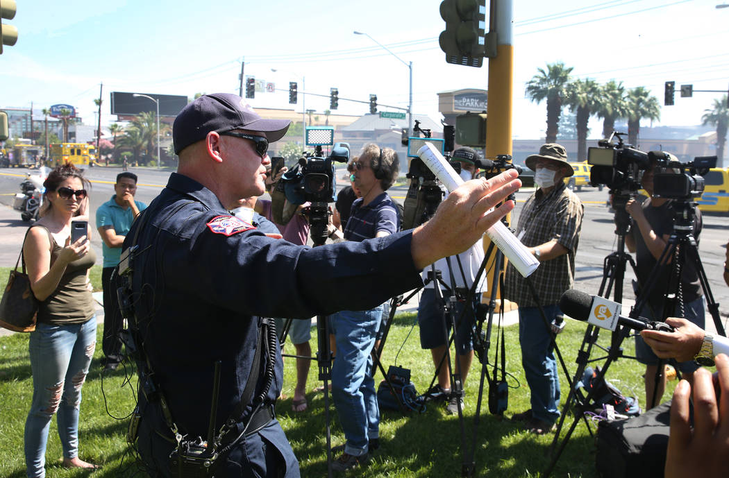 Clark County Fire Chief Greg Cassell, center, addresses the media during a news conference at T ...