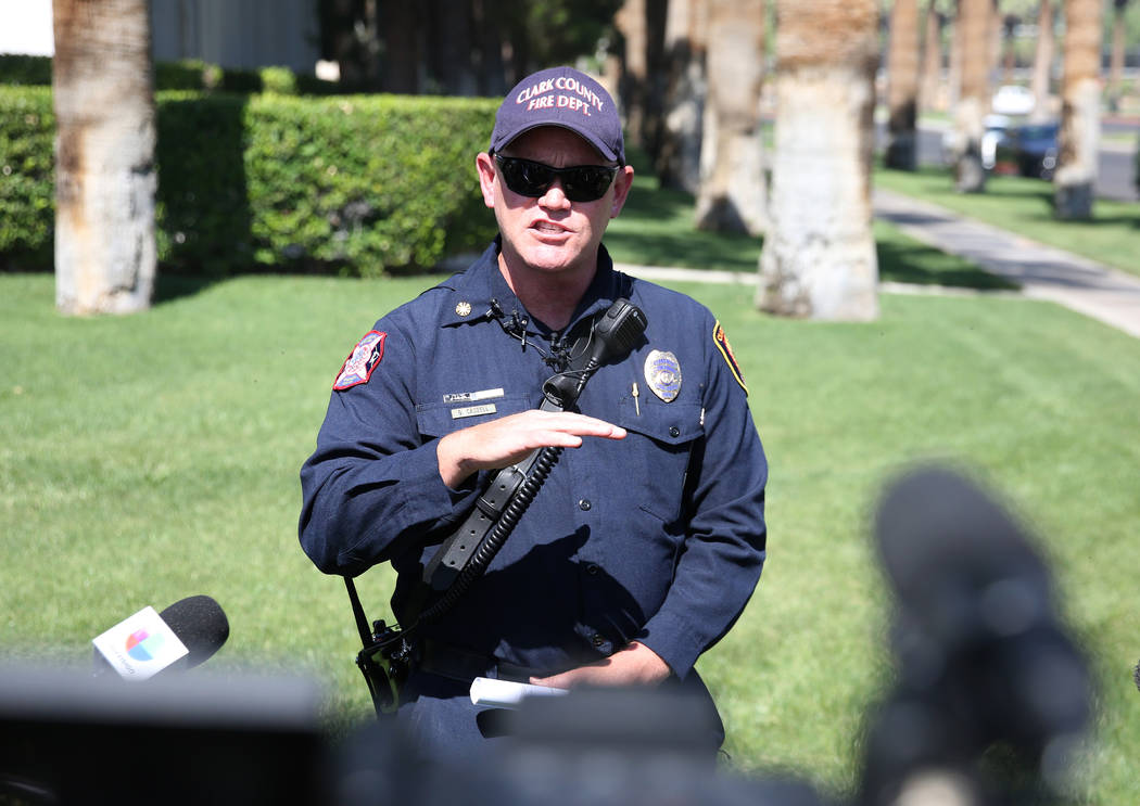 Clark County Fire Chief Greg Cassell, center, addresses the media during a news conference at T ...