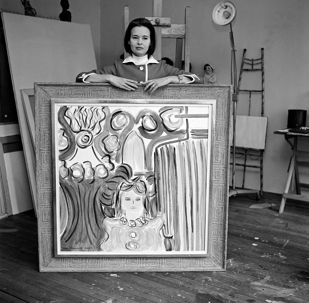 Gloria Vanderbilt Cooper poses with one of her paintings, at her private studio in New York Cit ...