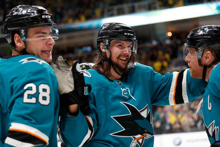 FILE - In this Feb. 16, 2019, file photo, San Jose Sharks' Erik Karlsson, center, celebrates wi ...