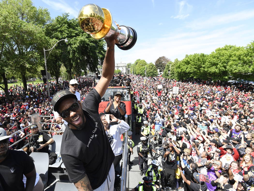 Toronto Raptors forward Kawhi Leonard holds his playoffs MVP trophy during the NBA basketball c ...