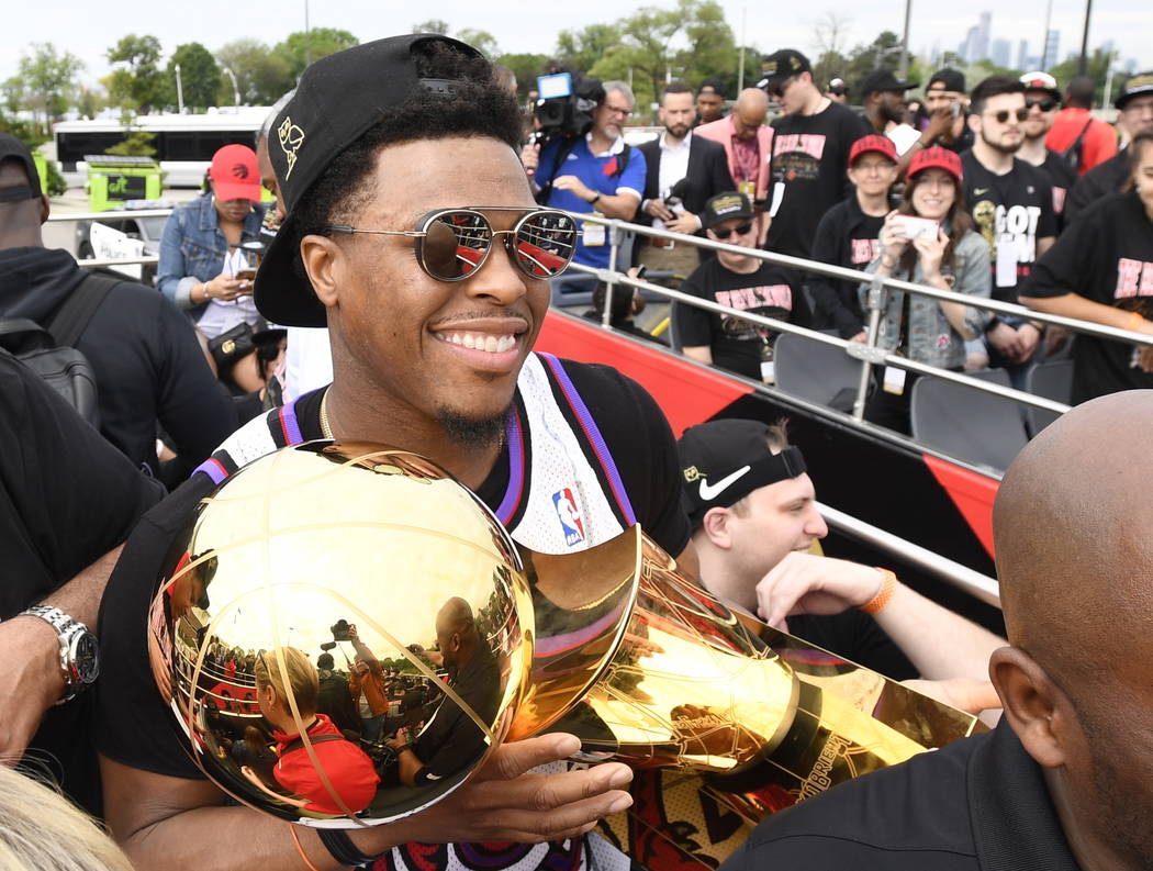 Toronto Raptors guard Kyle Lowry holds the Larry O'Brien Championship Trophy during the 2019 To ...