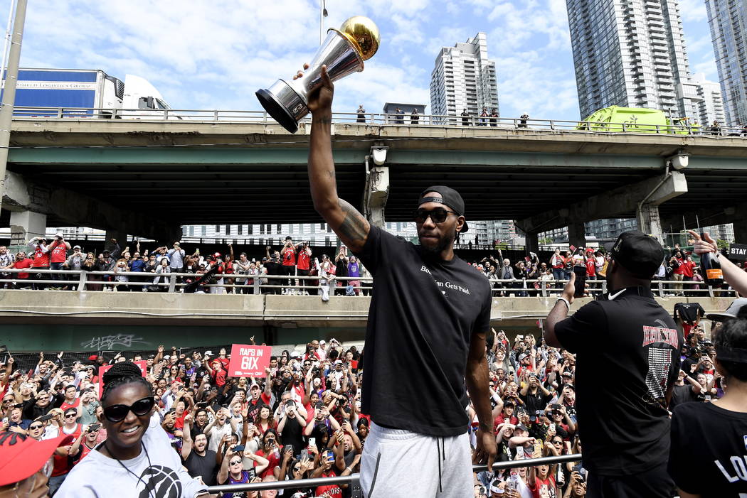 Toronto Raptors forward Kawhi Leonard holds his playoffs MVP trophy during the NBA basketball c ...