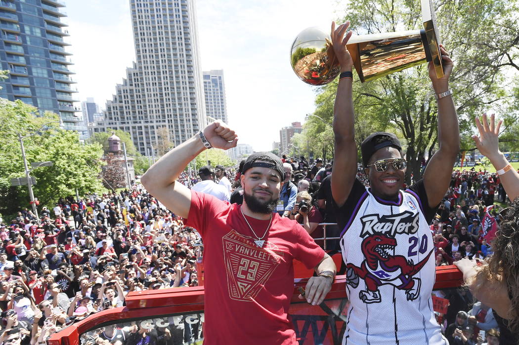 Toronto Raptors guard Fred VanVleet, left, and guard Kyle Lowry celebrate during the NBA basket ...