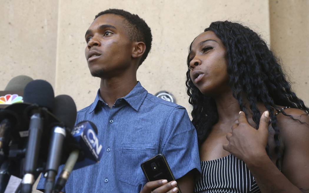 Iesha Harper, right, answers a question during a news conference as she is joined by her fiance ...