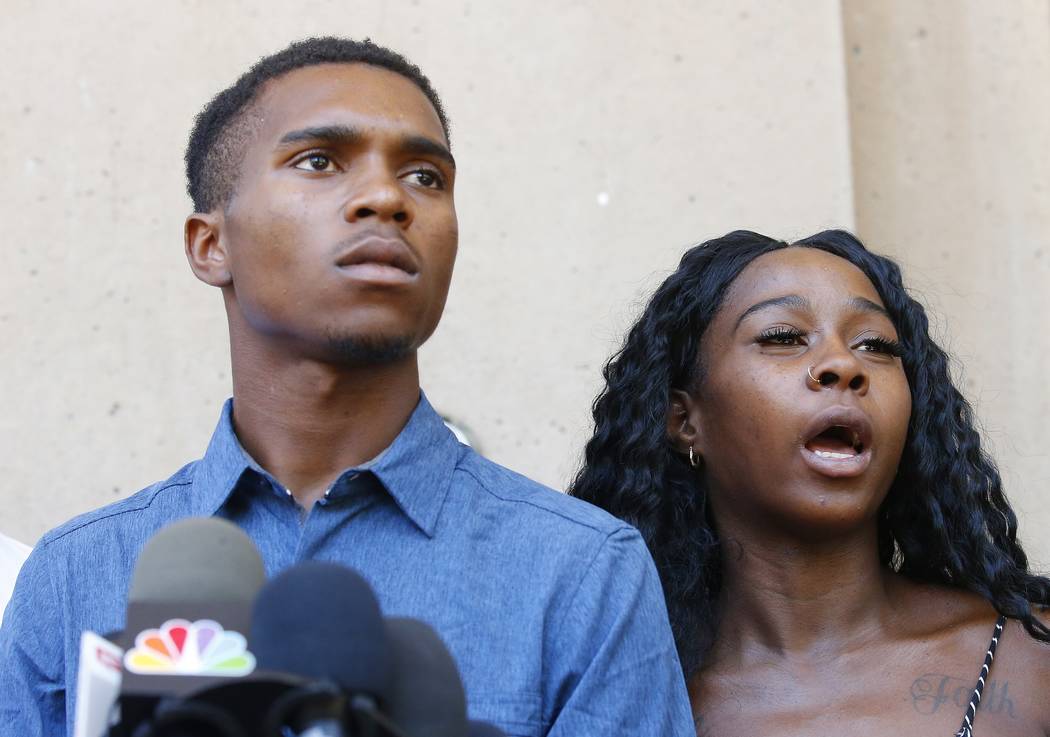 Iesha Harper, right, answers a question during a news conference as she is joined by her fiance ...