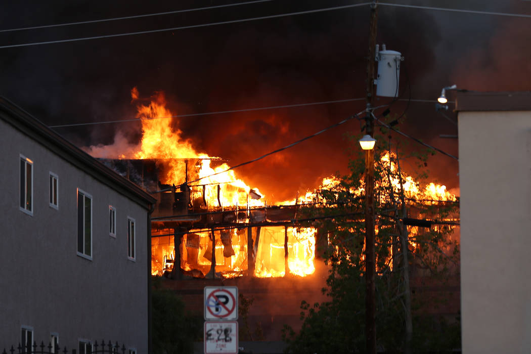 An early morning fire engulfs a business complex near Paradise Road and East Twain Avenue in La ...