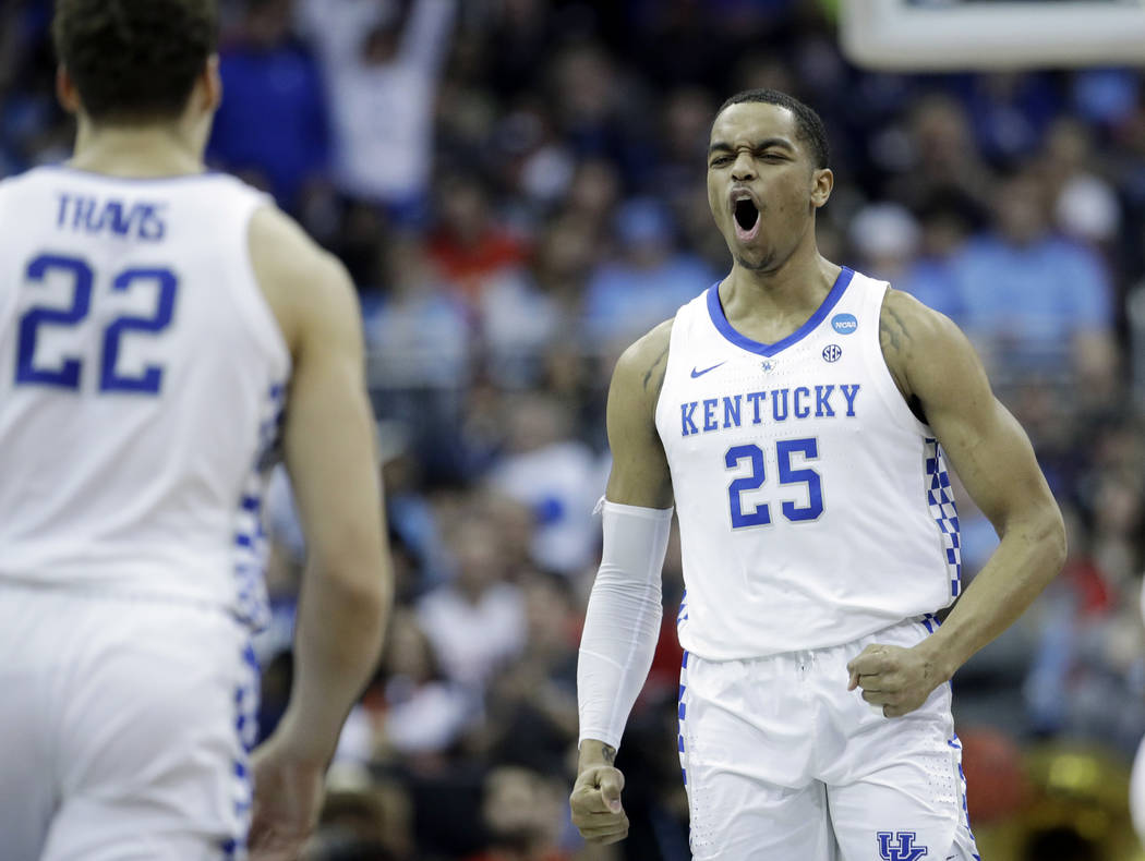 Kentucky's PJ Washington (25) celebrates with teammate Reid Travis (22) after scoring during th ...