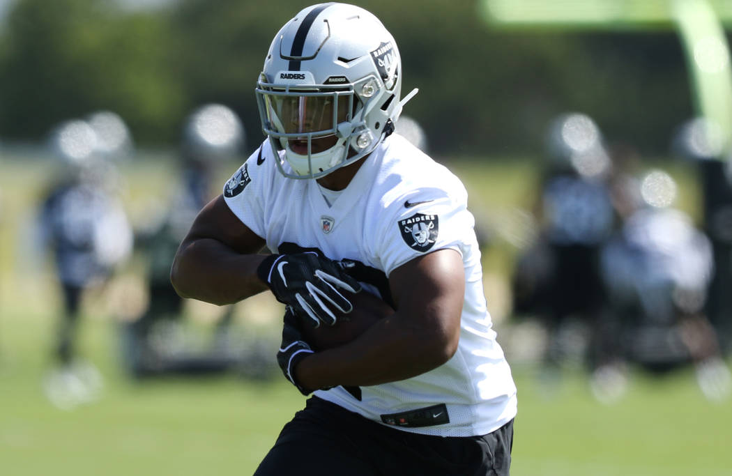 Oakland Raiders running back Josh Jacobs (28) runs with the football during an offseason traini ...