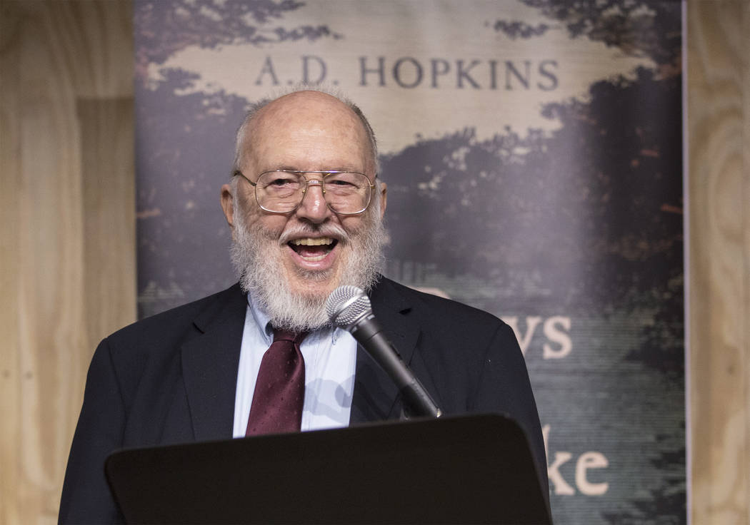 Author A.D. Hopkins reads from his novel "The Boys Who Woke Up Early" during a book r ...