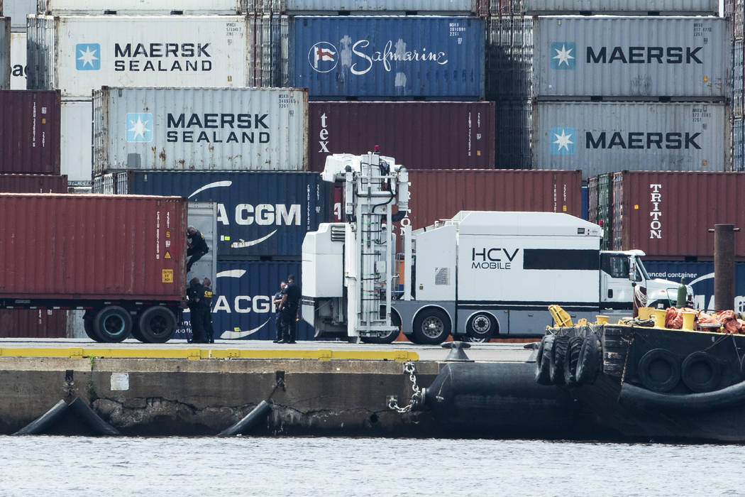 Authorities search a container along the Delaware River in Philadelphia, Tuesday, June 18, 2019 ...