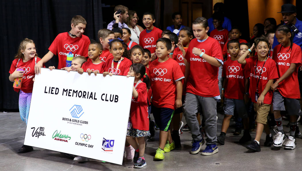 Lied Memorial Boys & Girls Club members march in the procession on Olympic Day at the Orlea ...