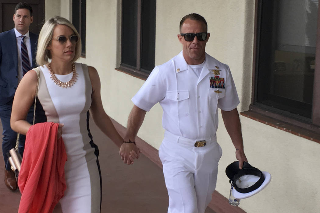 Navy Special Operations Chief Edward Gallagher, right, walks with his wife, Andrea Gallagher as ...