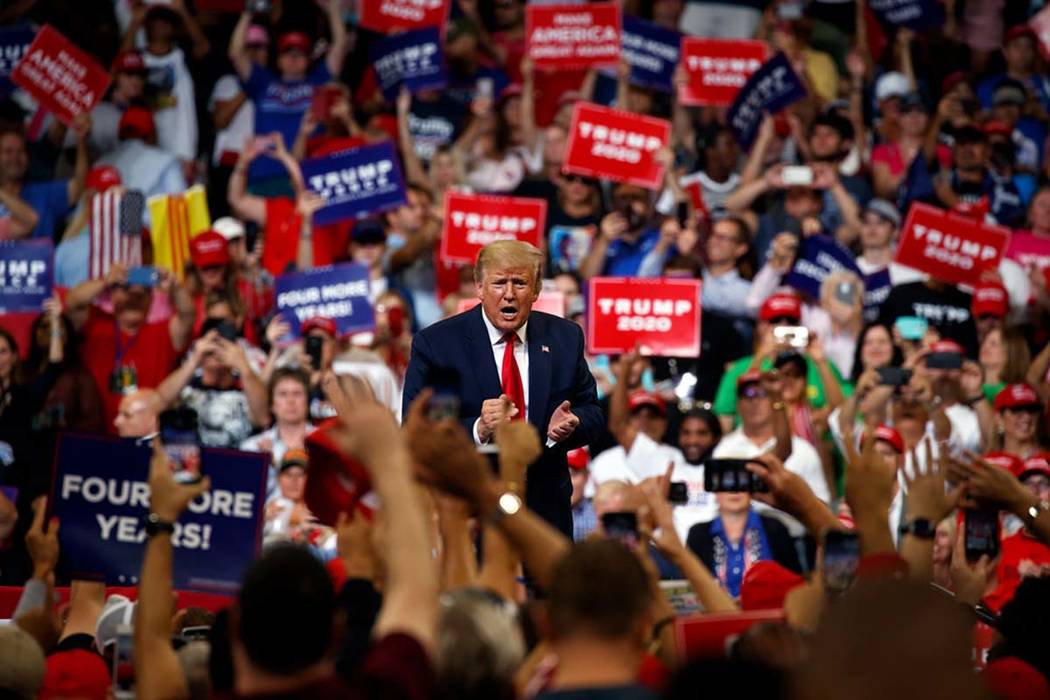 President Donald Trump reacts to the crowd after speaking during his re-election kickoff rally ...