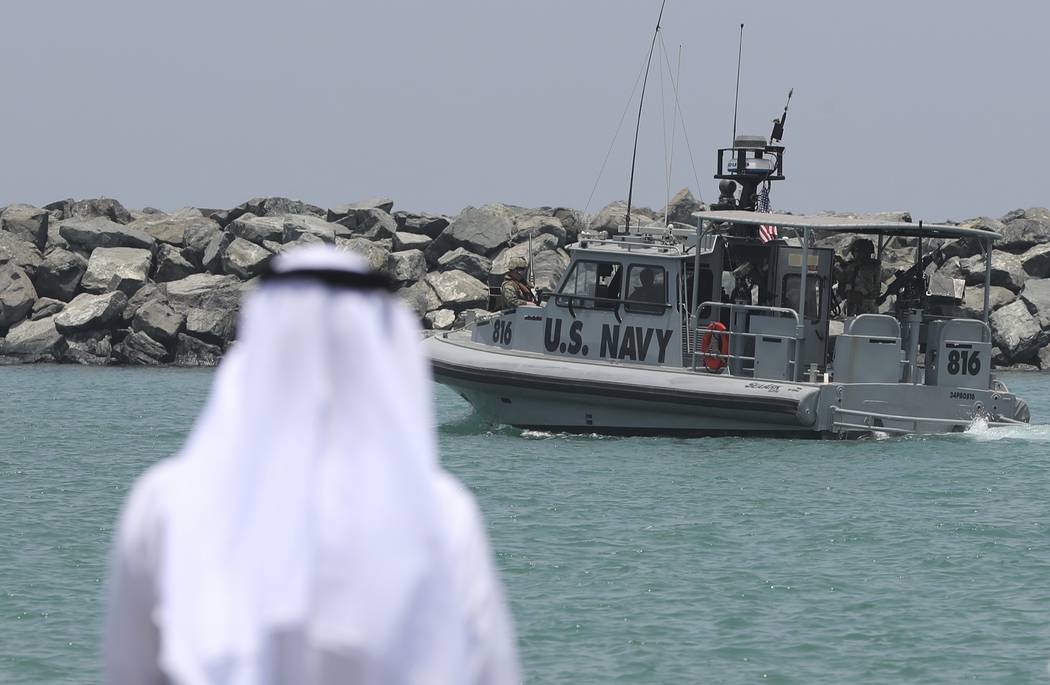 A U.S. Navy patrol boat carrying journalists to see damaged oil tankers leaves a U.S. Navy 5th ...