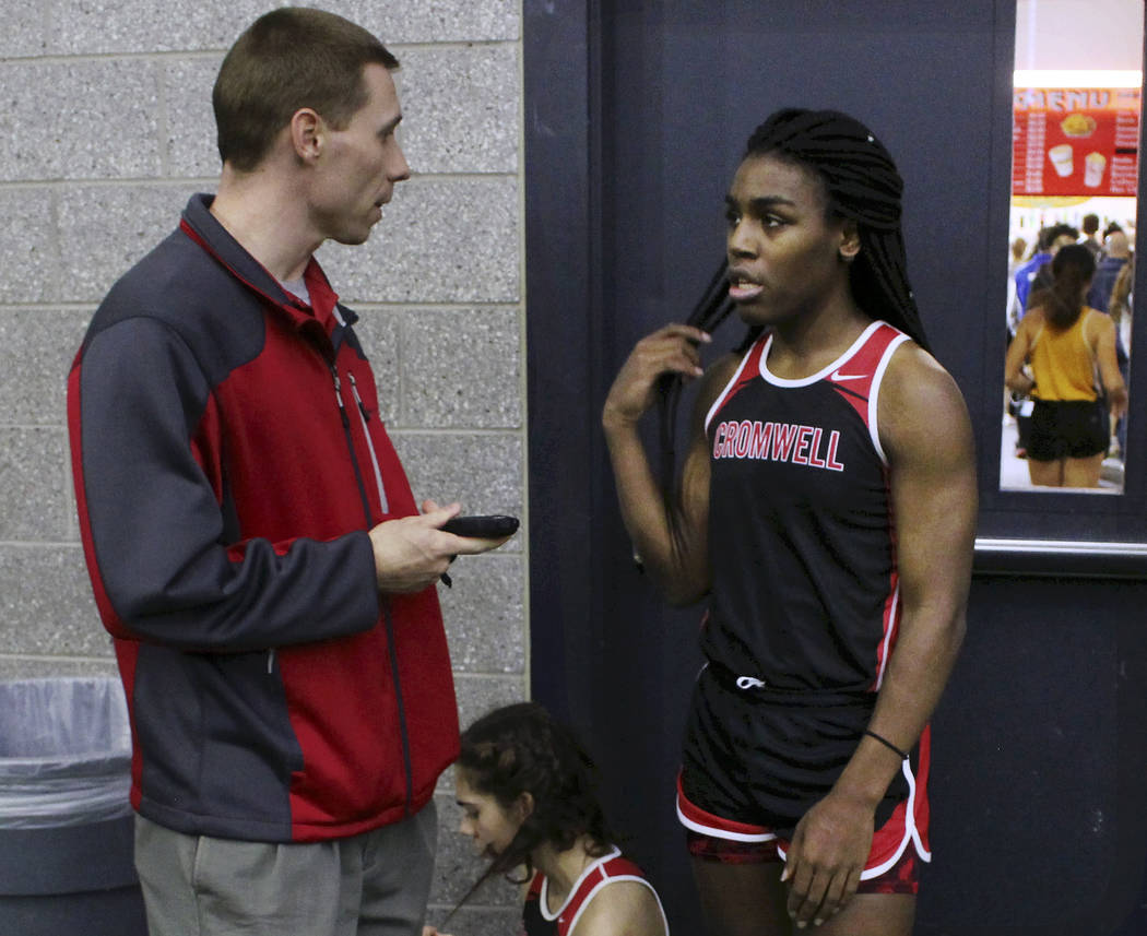 In this Feb. 7, 2019 file photo, Cromwell High School track coach Brian Calhoun, left, speaks t ...